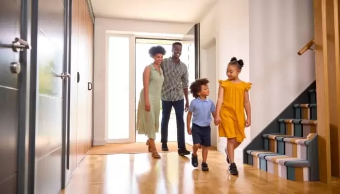 Family Walking Into Clean Home